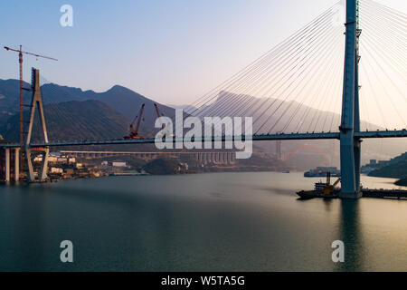 Aerial view of the last bridge deck of the Xiangxi Yangtze River Bridge being installed in Zigui county, Yichang city, central China's Hubei province, Stock Photo