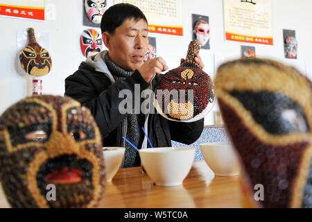 Chinese farmer Sun Xiaodong uses beans and cereals to make a Peking ...