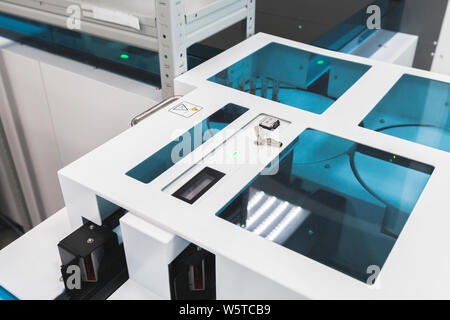 Blood samples bar code scanner on the tray of pre-analytical system. Clinical laboratory and blood bank, fully automated equipment Stock Photo