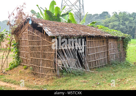Eco-friendly Tribal Hut having thatched roof, made from biodegradable Bamboo Straws and sticks. Typical house form of Tribal areas in Asia and Africa. Stock Photo