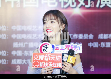 Chinese actress Wu Jinyan is interviewed during the 5th Awards Ceremony of the Actors of China in Chengdu city, southwest China's Sichuan province, 28 Stock Photo