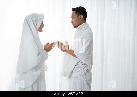 muslim asian couple shake hands Stock Photo