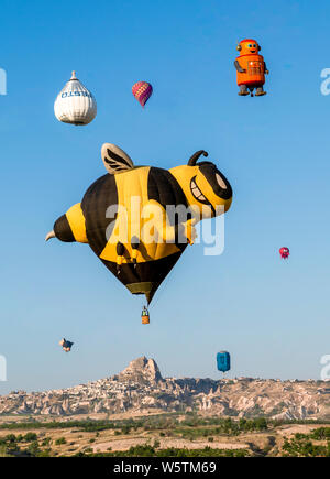 Cappadocia / Turkey - July 07 2019: Various cartoon shape balloons around Uchisar Region during Cappadocia Balloon Festival Stock Photo