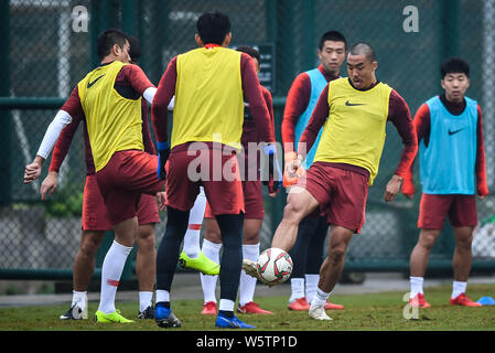 Zhao Xuri, front right, and teammates of the Chinese national men's football team take part in a training session for the 2019 AFC Asian Cup in Haikou Stock Photo