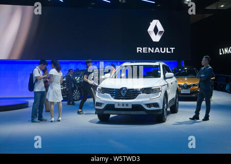 --FILE--People visit the stand of Dongfeng Renault during the 16th China (Guangzhou) International Automobile Exhibition, also known as Auto Guangzhou Stock Photo