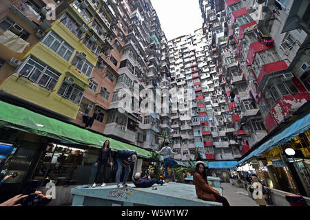 View of the Monster Building (Yik Cheong Building), one of Hong Kong's most Instragrammable sites, known for its incredibly dense and stacked flats, i Stock Photo