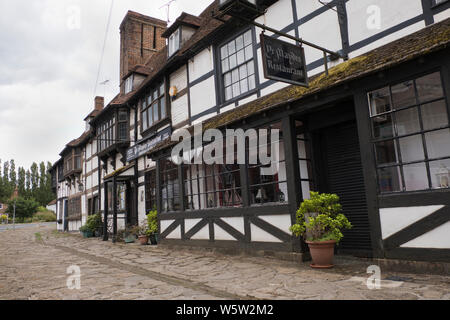 Original 1400s and Tudor buildings and pavement along Biddenden high street in Kent England Stock Photo