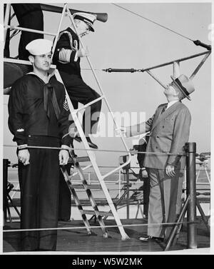 Photograph of President Truman and Fleet Admiral William D. Leahy inspecting the U.S.S. TUSK, a submarine, during the President's visit to the U.S. Naval Academy. Stock Photo