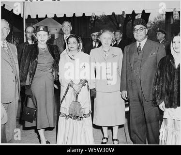 Photograph of President Truman and Pakistani Prime Minister Liaquat Ali Khan in Washington, during the Prime Minister's visit to the United States, with Mrs. Truman; Margaret Truman; the Prime Minister's wife, the Begum Sahiba; Secretary of State Dean Acheson; and others. Stock Photo