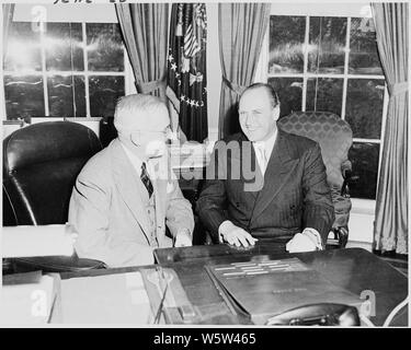Photograph of President Truman at his desk in the Oval Office with Crown Prince Olav of Norway. Stock Photo