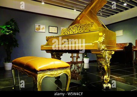 --FILE--A piano of Steinway & Sons, the US-German high-end piano maker, is displayed at the Wuhan Qintai Piano Museum in Wuhan city, central China's H Stock Photo