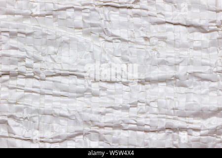 Texture and Wrinkles of white plastic net bag. Concept of recycle product or global warming. Stock Photo