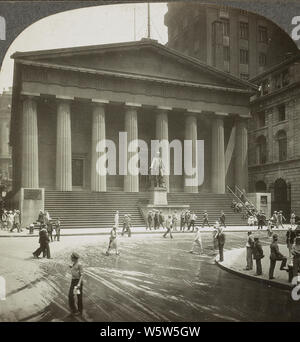 Federal Hall (The U.S. Subtreasury, where Washington became President) and Trinity Church in New York City in 1928. The current structure, completed in 1842 and one of the best surviving examples of neoclassical architecture in New York, was built as the U.S. Custom House for the Port of New York. Later it served as a sub-Treasury building. Though never referred to as 'Federal Hall', today it is operated by the National Park Service as a national memorial and designated the Federal Hall National Memorial to commemorate the historic events that occurred at the previous structure. Stock Photo