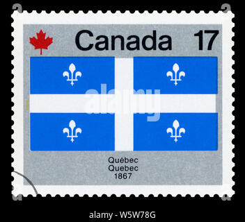 CANADA - CIRCA 1979: A stamp printed in Canada from the 'Canada Day. Flags' issue shows Quebec flag, circa 1979. Stock Photo