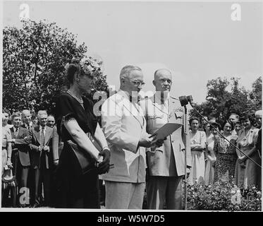 Photograph Of President Truman Reading The Citation For General Dwight D Eisenhower S Distinguished Service Medal While The General And Mrs Eisenhower Look On Stock Photo Alamy