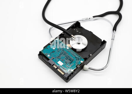 stethoscope with hard disk isolated and white background (this image for technology security checkup concept) Stock Photo