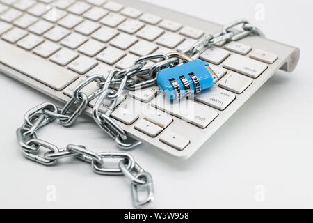 chain locked with password protection on computer keyboard (this image for security technology concept) Stock Photo