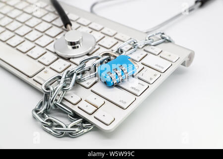 stethoscope with computer keyboard isolated and white background (this image for technology security checkup concept) Stock Photo