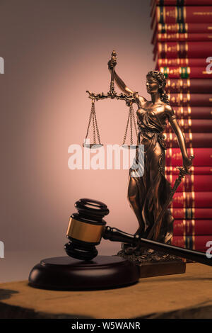 gavel, law books and justice statue shot in studio Stock Photo