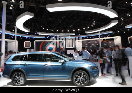 --FILE--People visit the stand of FAW-Volkswagen during the 15th Beijing International Automotive Exhibition, also known as Auto China 2018, in Beijin Stock Photo