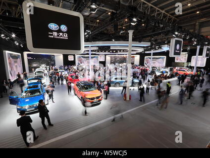 --FILE--People visit the stand of FAW-Volkswagen during the 15th Beijing International Automotive Exhibition, also known as Auto China 2018, in Beijin Stock Photo