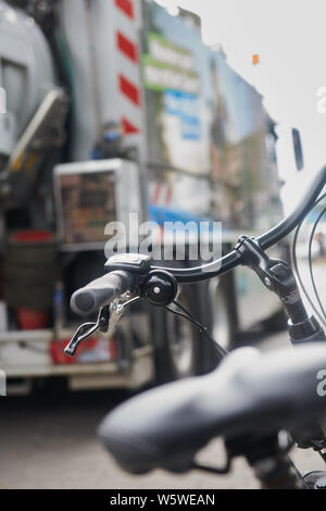 Berlin, Germany. 30th July, 2019. A bicycle stands in front of a truck. Berliner Wasserbetriebe is presenting three of its 88 lorries retrofitted with turn-off assistants. Credit: Annette Riedl/dpa/Alamy Live News Stock Photo