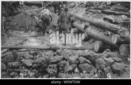 Photograph with caption Lake City Breakwater, removing old crib. Stock Photo