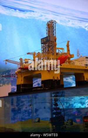 A model of the ultra-deep-water semi-submersible drilling rig 'Blue Whale II', which can mine both combustible ice and oil, is on display during a maj Stock Photo