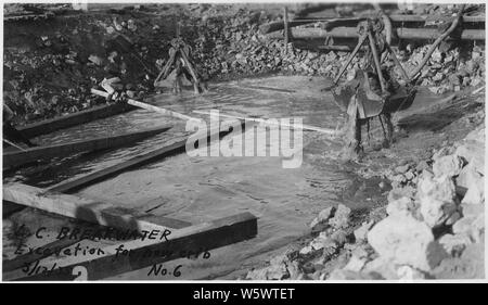 Photograph with caption Lake City breakwater. excavation for new crib. Stock Photo