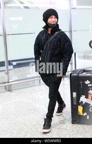 Chinese actor and singer Aloys Chen Kun leaves the Shanghai Hongqiao International Airport as he is absent from the Italian fashion brand Dolce and Ga Stock Photo