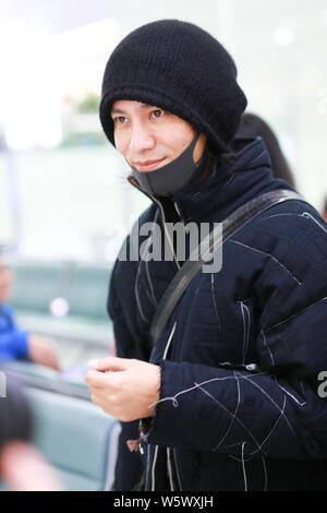 Chinese actor and singer Aloys Chen Kun leaves the Shanghai Hongqiao International Airport as he is absent from the Italian fashion brand Dolce and Ga Stock Photo