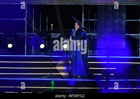 Malaysian singer-songwriter Shila Amzah poses as she arrives on