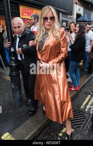 London, UK. 30th July 2019.  Jennifer Coolidge, American actress, who played Stifler's mum in 1999 comedy American Pie, serves up apple pies at pop-up pie shop as Now TV celebrates the 20th anniversary of the comedy, at 48 Poland Street  London, UK - 30 July 2019 Credit: Nils Jorgensen/Alamy Live News Stock Photo