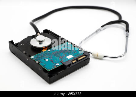 stethoscope with hard disk isolated and white background (this image for technology security checkup concept) Stock Photo