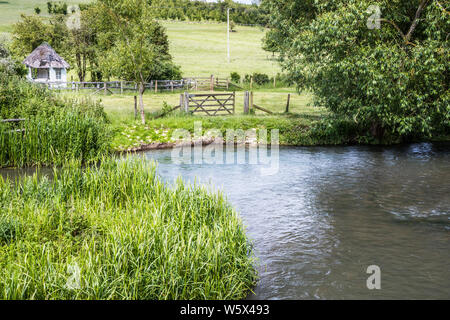 The River Windrush in summer in the Cotswolds. Stock Photo