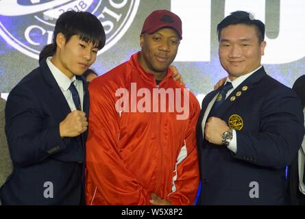 Jamaican-American IFBB professional bodybuilder Shawn Rhoden, center, poses for photos with participants during a bodybuilding competition in Shanghai Stock Photo