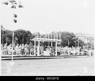 President Truman attends ceremonies celebrating the 100th anniversary of the Washington Monument. He is in the reviewing stand.