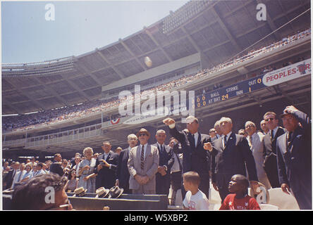 President attends the 32nd All-Star Baseball Game, throws out first ball. Speaker of the House John W. McCormack, Dave Powers, Vice President Johnson, President Kennedy, Commisioner of Baseball Ford. C. Frick, Lawrence O'Brien, others ( in foreground- Dennis Marcel, Frank Brown, members of the Washington Boys Club ). Washington, D.C., D.C. Stadium Stock Photo