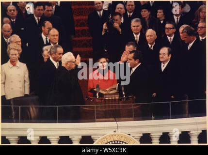 President-elect Nixon taking the oath of office as President of the United States; Scope and content:  Pictured: Lyndon Baines Johnson, Everett M. Dirksen, Thelma Ryan (Pat) Nixon, Richard M. Nixon, Hubert H. Humphrey. Subject: Inauguration - 1969. Stock Photo