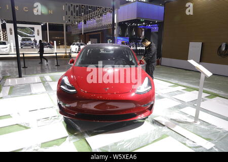 --FILE--A Tesla Model 3 electric car is on display ahead  of the First China International Import Expo (CIIE) and the Hongqiao International Economic Stock Photo