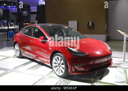 --FILE--A Tesla Model 3 electric car is on display ahead  of the First China International Import Expo (CIIE) and the Hongqiao International Economic Stock Photo