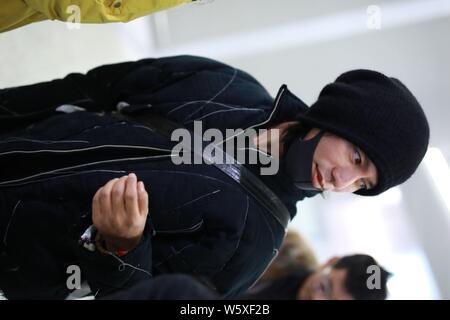 Chinese actor and singer Aloys Chen Kun leaves the Shanghai Hongqiao International Airport as he is absent from the Italian fashion brand Dolce and Ga Stock Photo