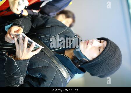 Chinese actor and singer Aloys Chen Kun leaves the Shanghai Hongqiao International Airport as he is absent from the Italian fashion brand Dolce and Ga Stock Photo