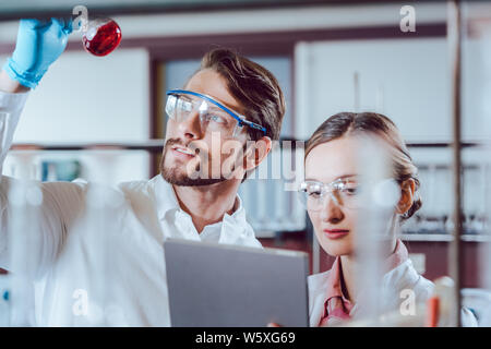 Scientists in the lab obtaining experimental data Stock Photo