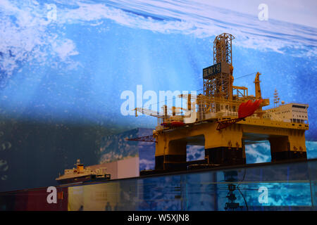 A model of the ultra-deep-water semi-submersible drilling rig 'Blue Whale II', which can mine both combustible ice and oil, is on display during a maj Stock Photo