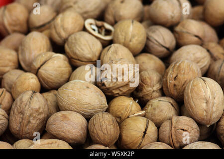 shelled walnut texture background. Heap of walnuts close up Stock Photo