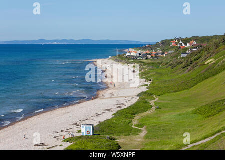 View along beach and village to the Swedish mainland in distance, Rageleje, Region Hovedstaden, Zealand, Denmark, Europe Stock Photo