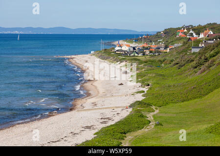 View along beach and village to the Swedish mainland in distance, Rageleje, Region Hovedstaden, Zealand, Denmark, Europe Stock Photo