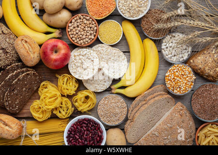 Rich on carbohydrates food with wholegrain bread and fruits Stock Photo