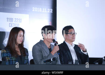 South Korean actress Song Ji-hyo, left, and actor Kim Sung-oh, center, attend a press conference for new movie 'Unstoppable' in Seoul, South Korea, 8 Stock Photo